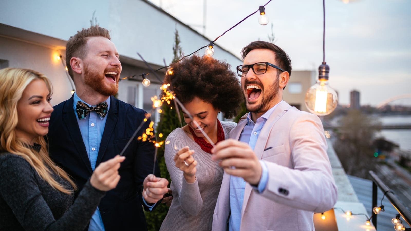 Employees celebrating Happy employees outside celebrating