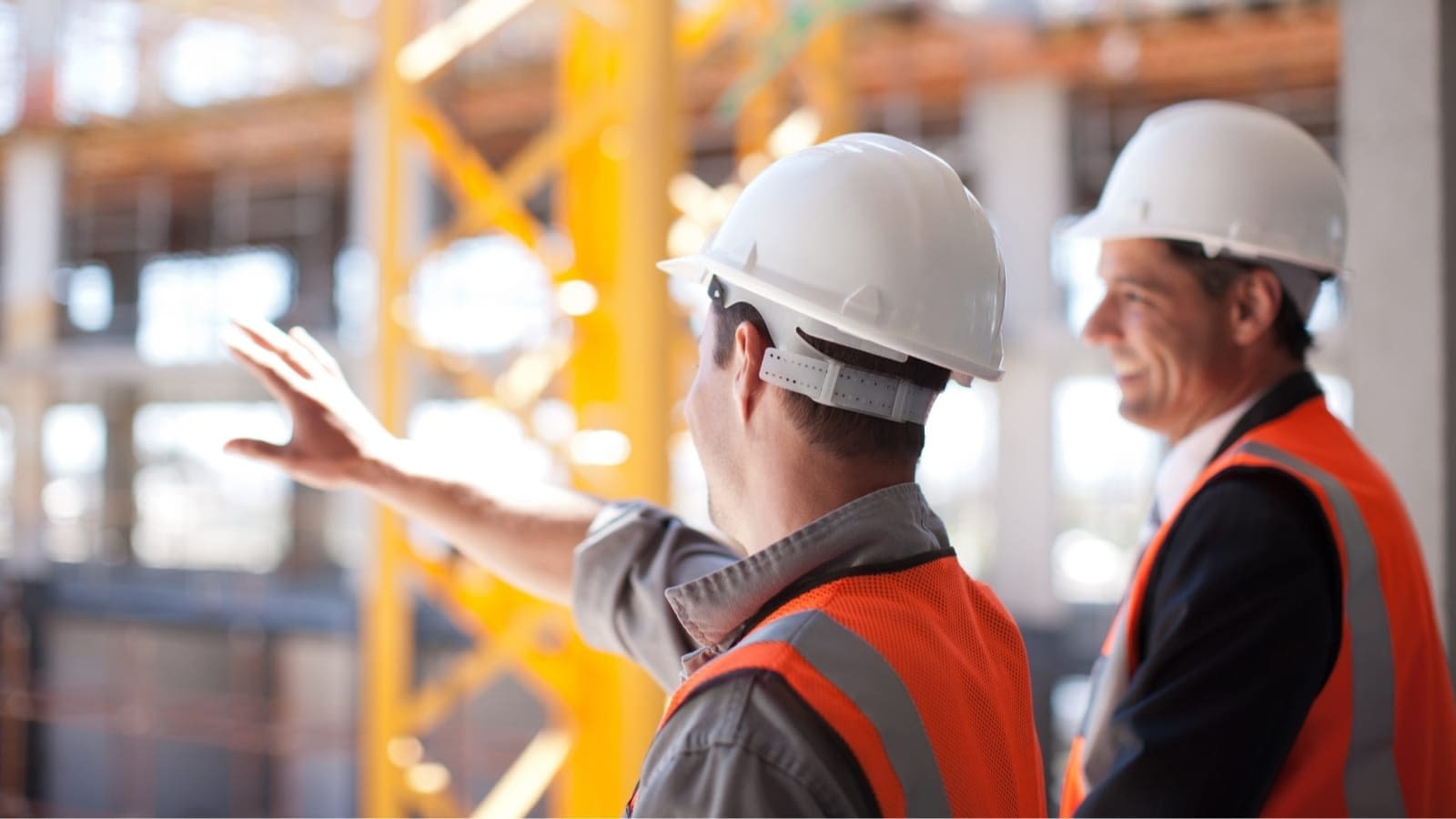 construction-and-development construction supervisors pointing out details