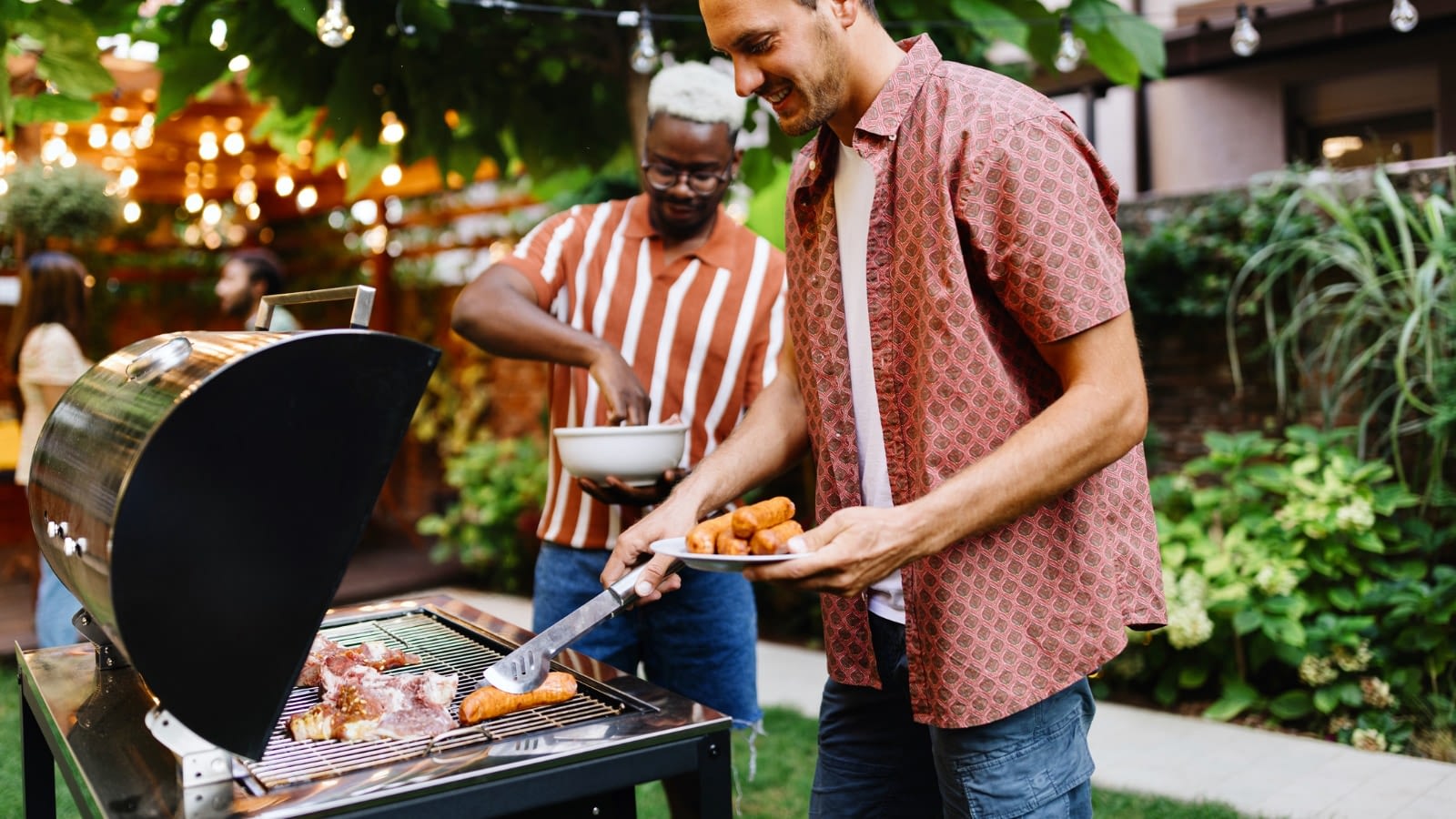 July 16 blog Two men grilling in backyard