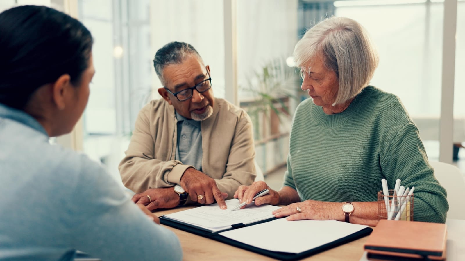 July 7 blog Older couple planning estate with life insurance agent.