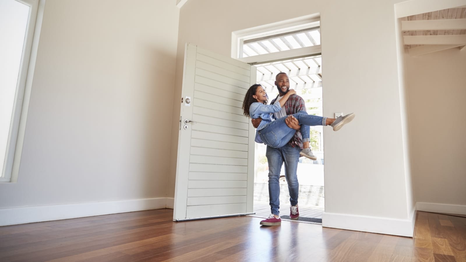 Man and woman entering new home