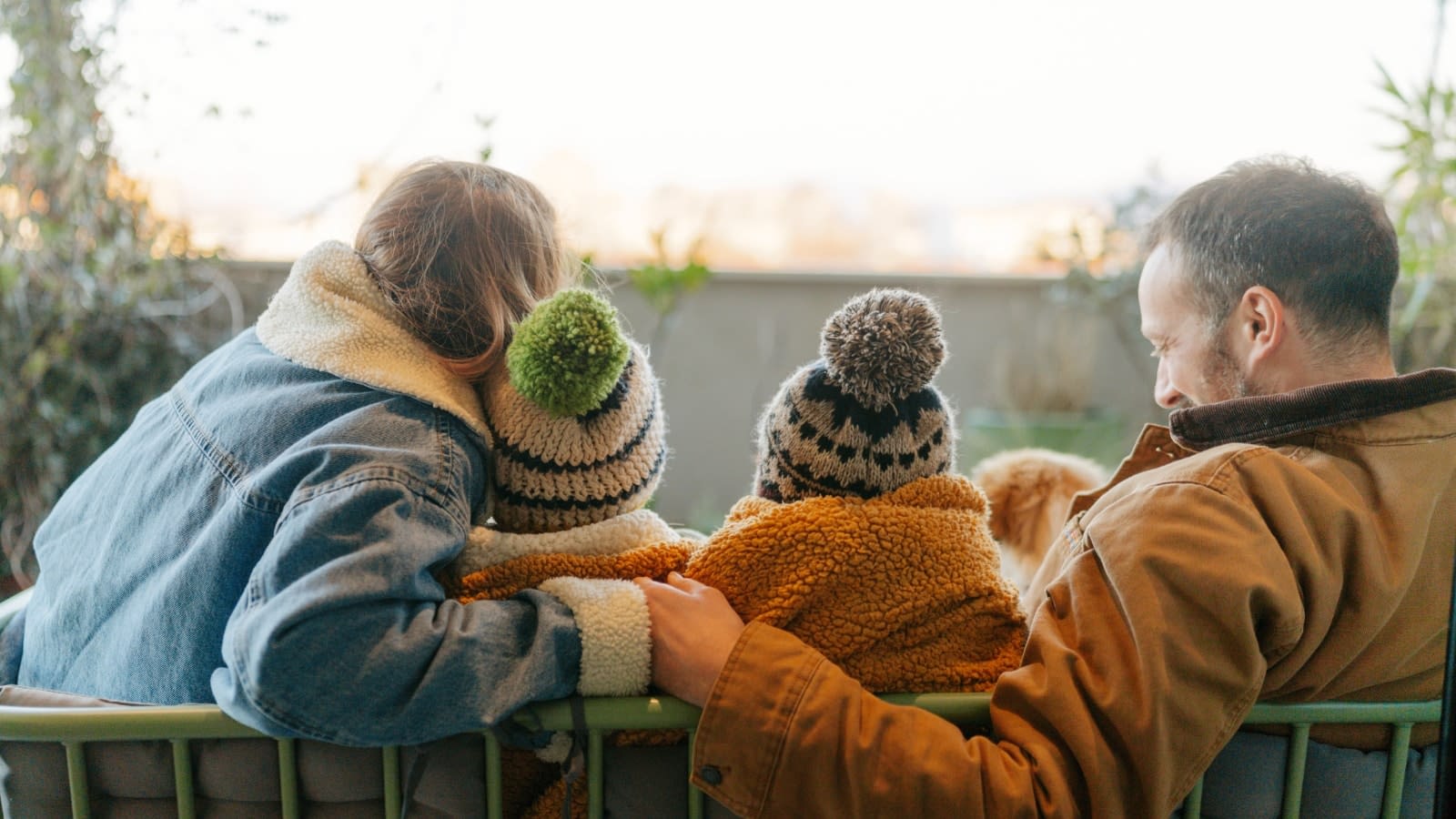 Jan 22 blog family in winter gear sitting on bench