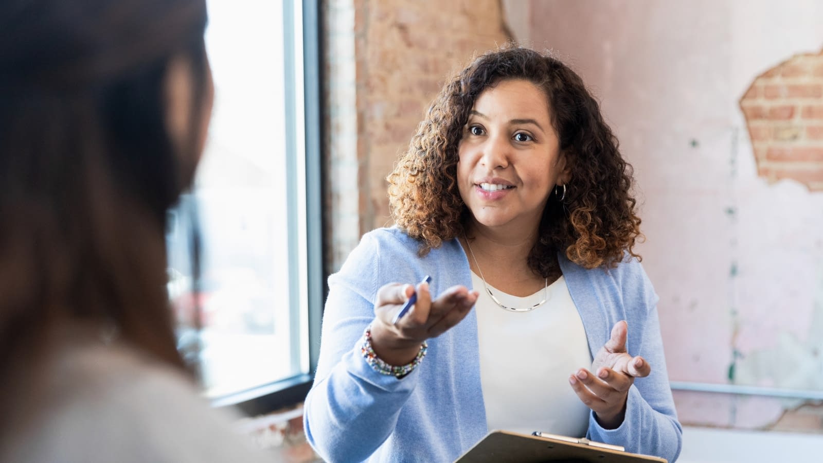 strong female leader female leader speaking to employees