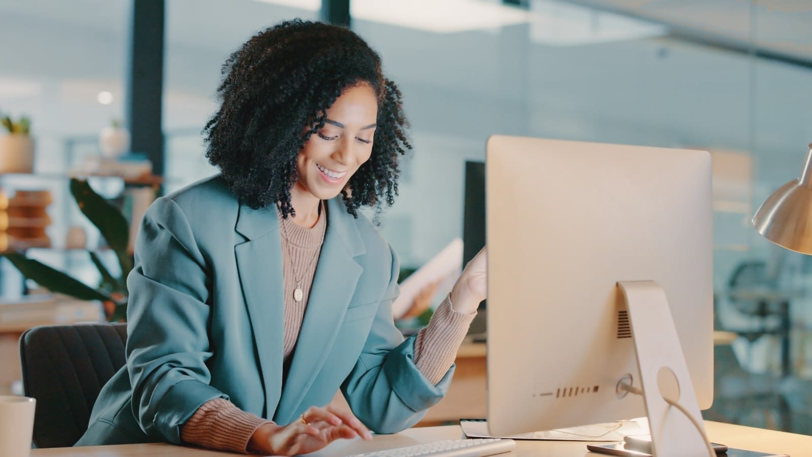 July 4 blog Young female business woman reading laptop