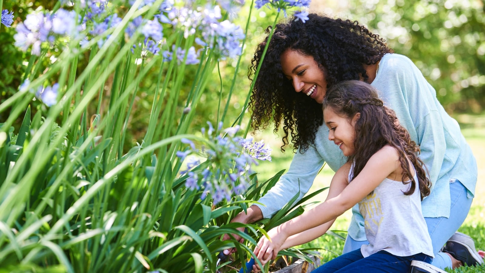 mother and daughter picking flowers