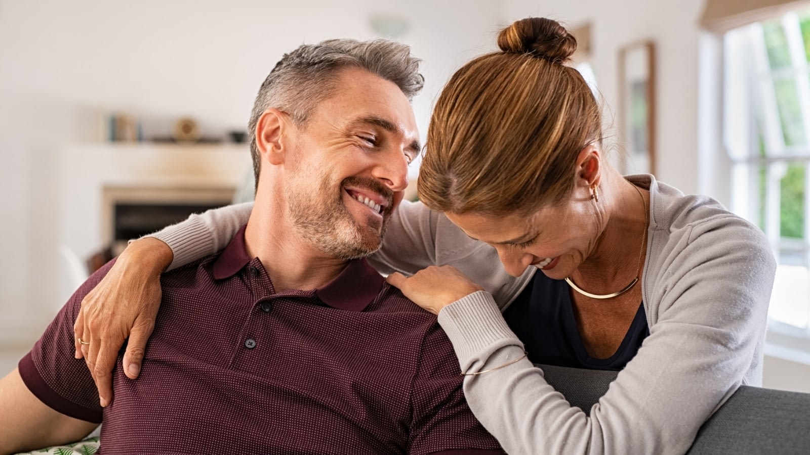 older couple laughing and embracing