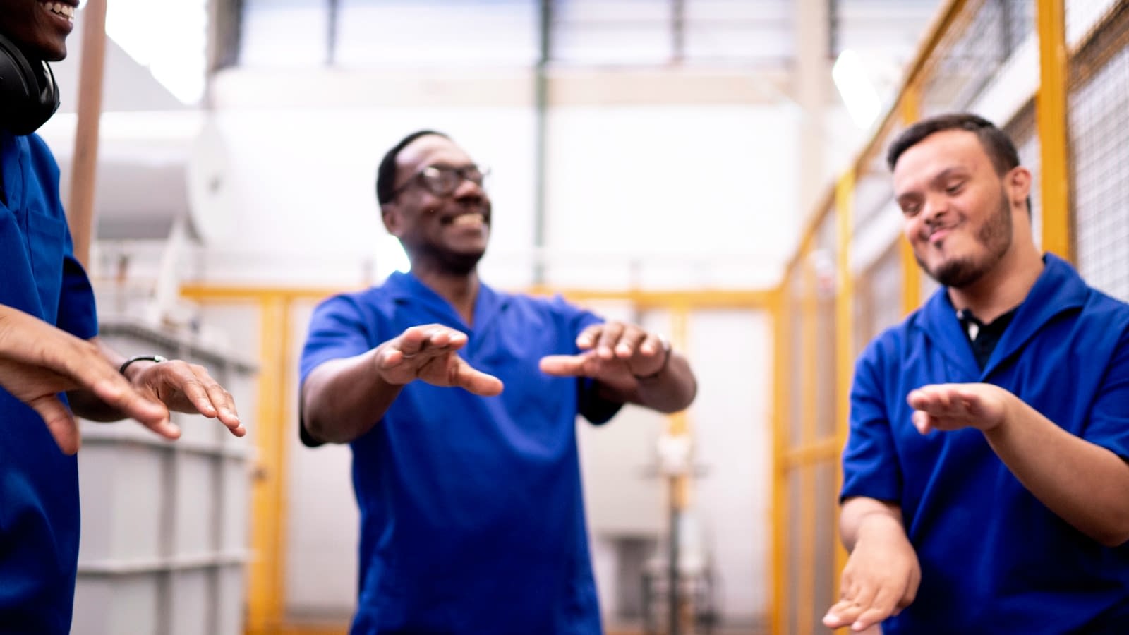 Oct 1 blog Warehouse employees dancing and laughing together