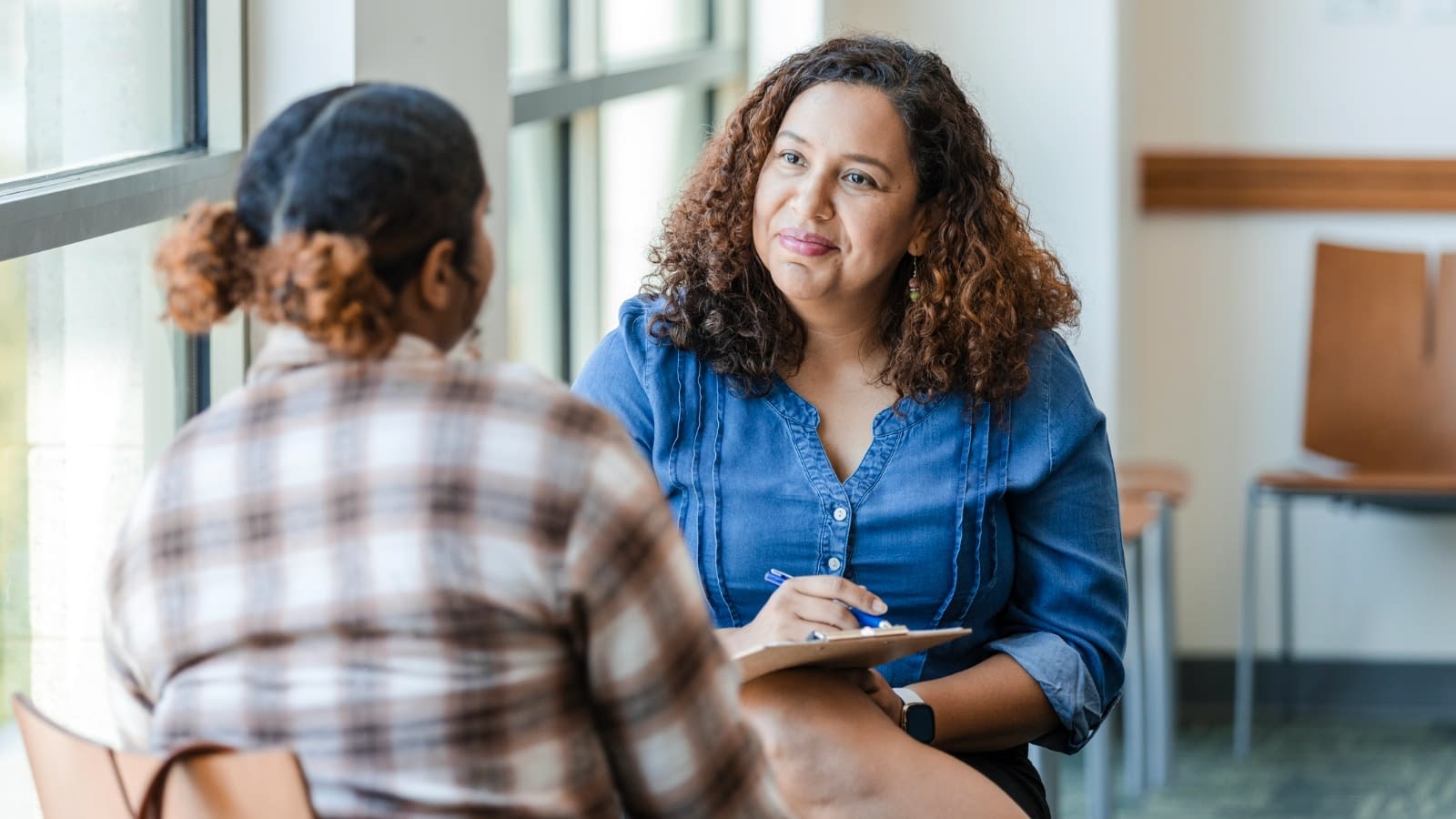 Dec 10 blog young woman speaking with therapist