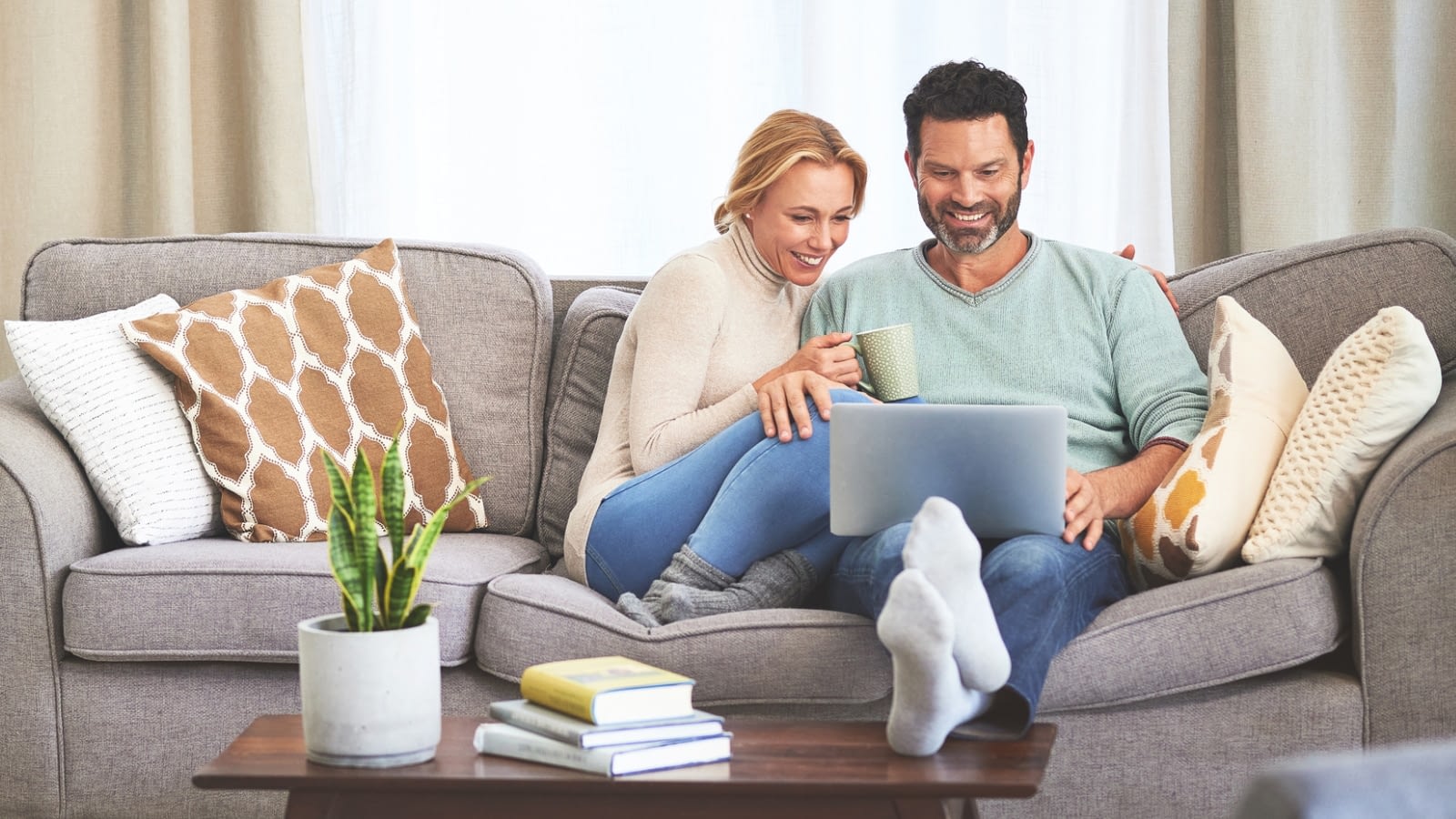 couple reviewing insurance on their laptop