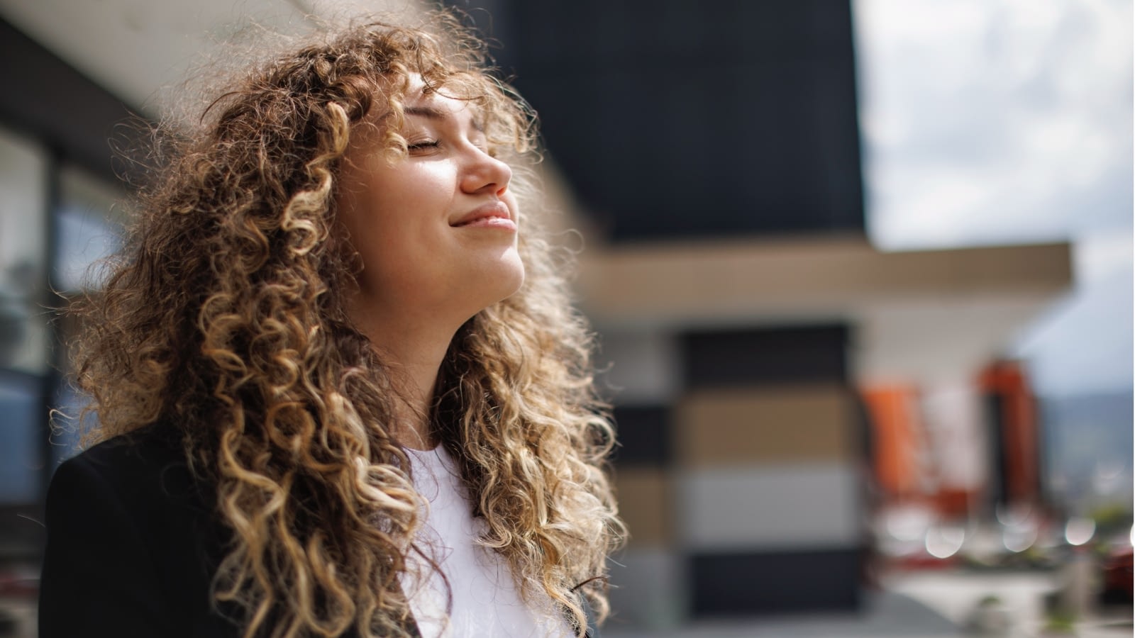 young woman taking a moment to breathe and relax