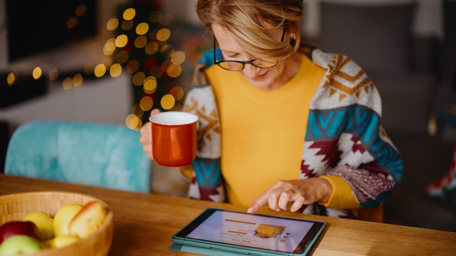 woman holiday shopping on iPad