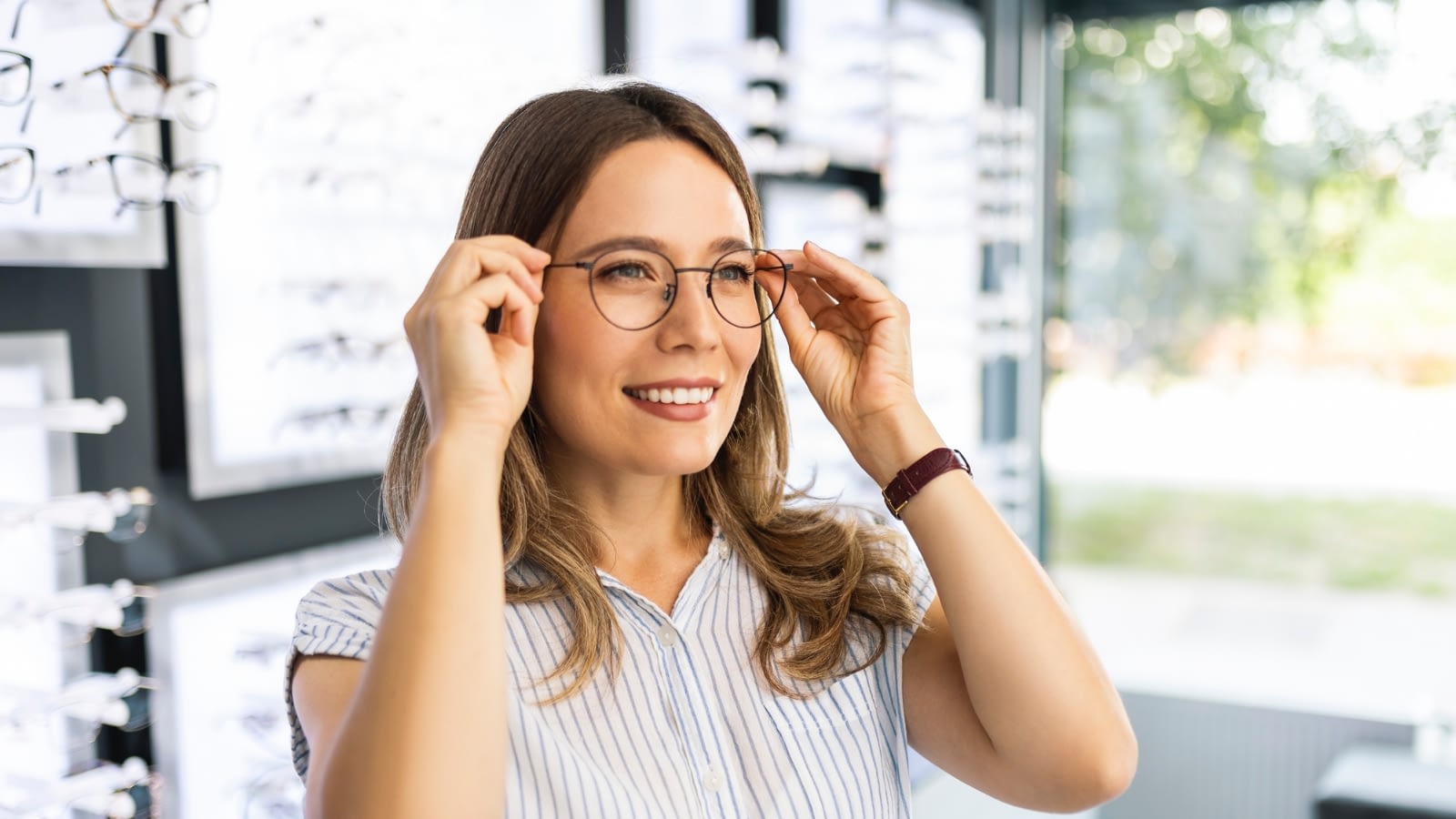 woman trying on glasses