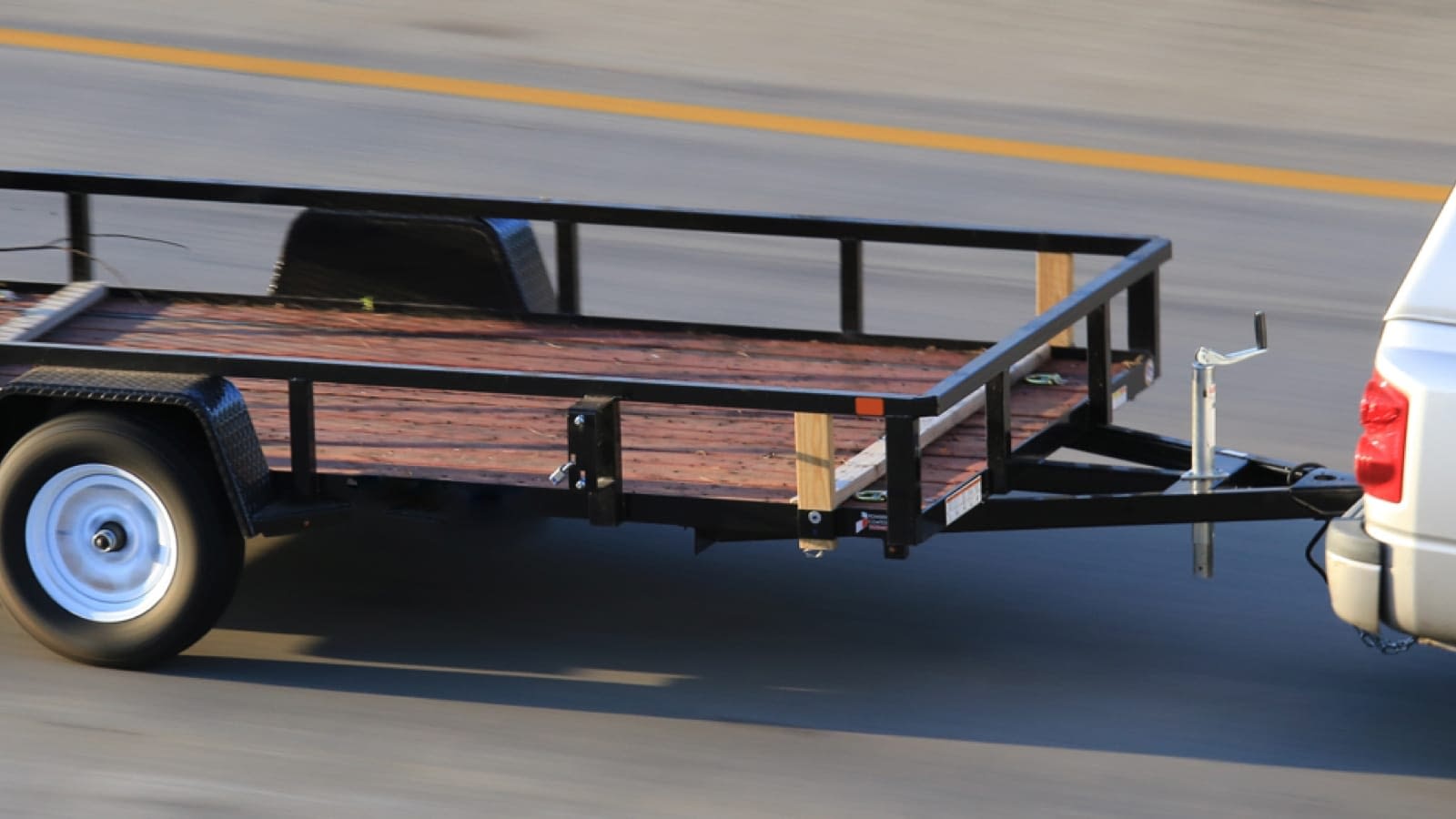 trailer-large SUV towing an empty trailer