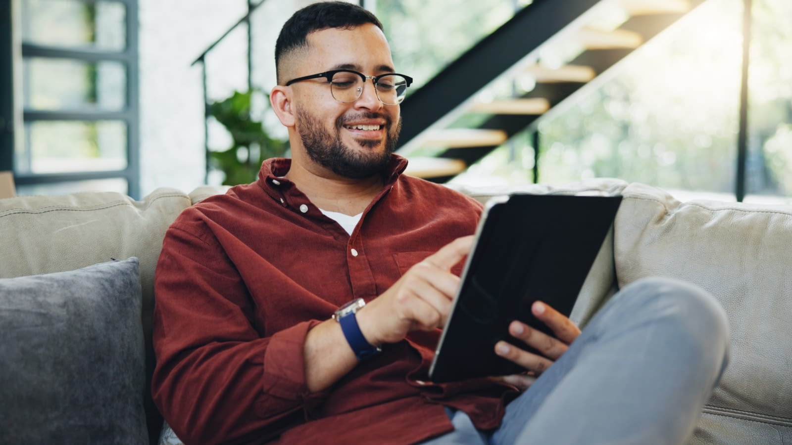 Oct 25 blog Young man reading HSA info on iPad