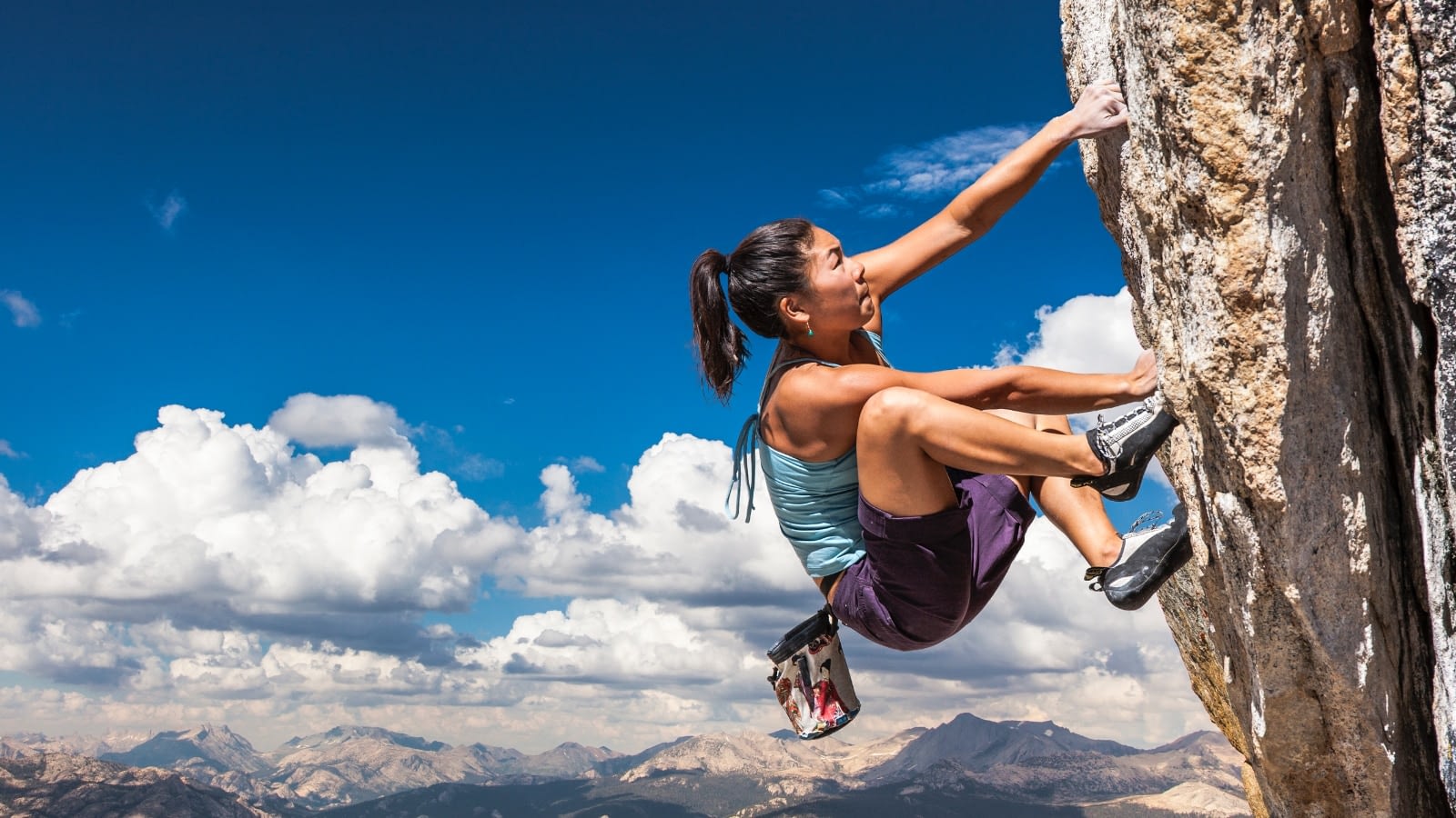 woman rock climbing