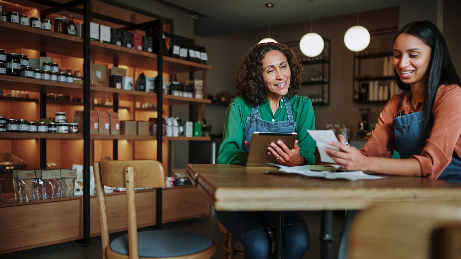 April 4 blog Two female business owners having discussion in shop.