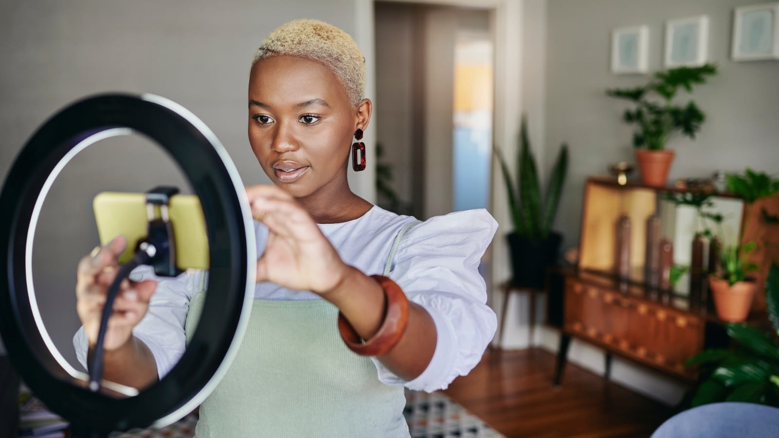 woman preparing to record a video on phone