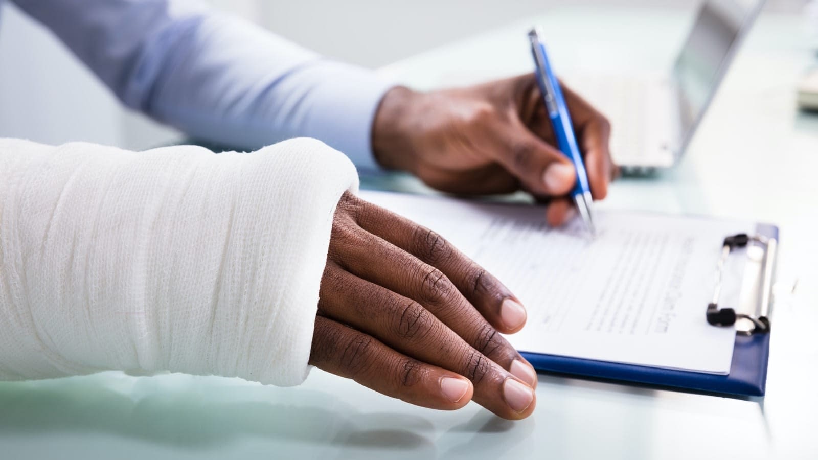 Injured-Hand-Signing-Form.jpg