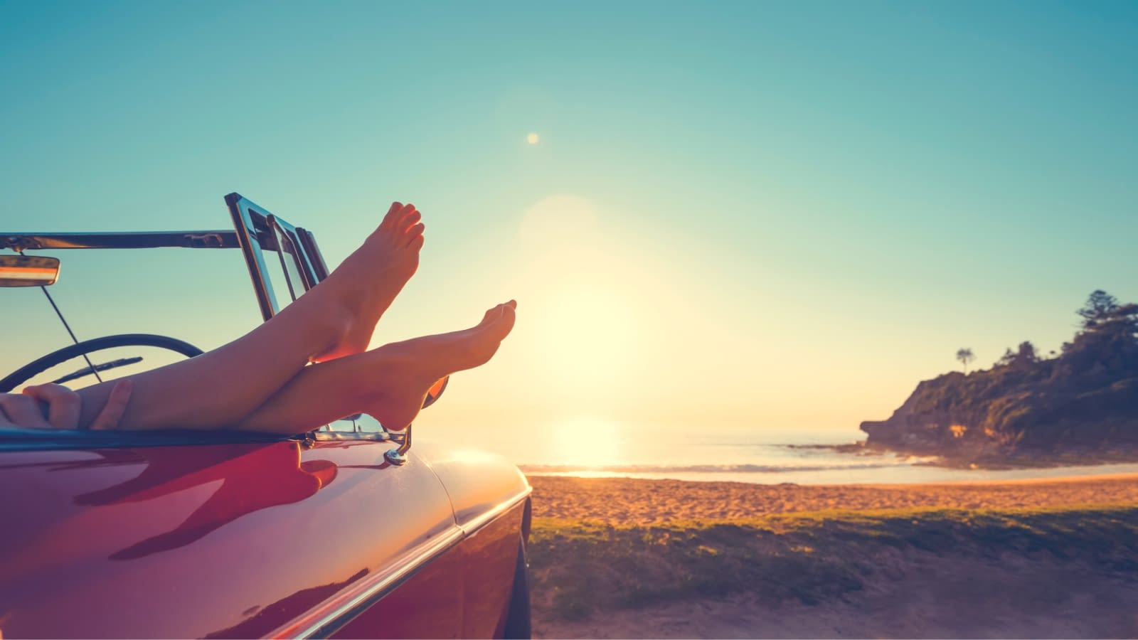 March 2 blog person lounging barefoot in car
