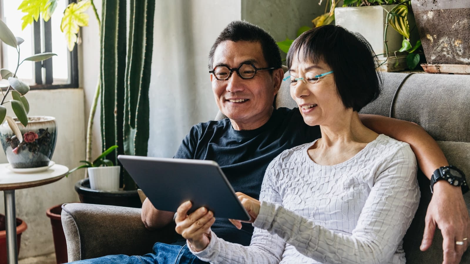 Oct 21 blog Older Asian couple reading medicare info on iPad