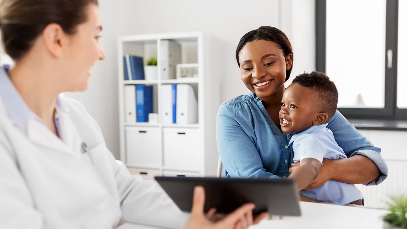 Woman and Child Visiting Doctor