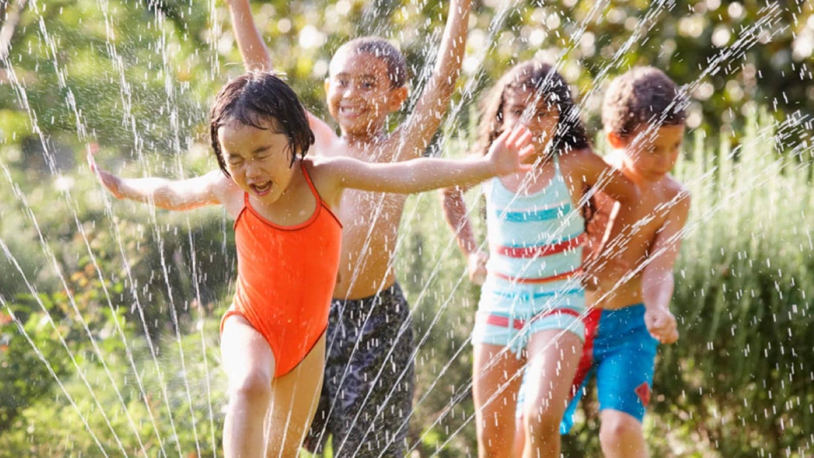 Children playing in a sprinkler