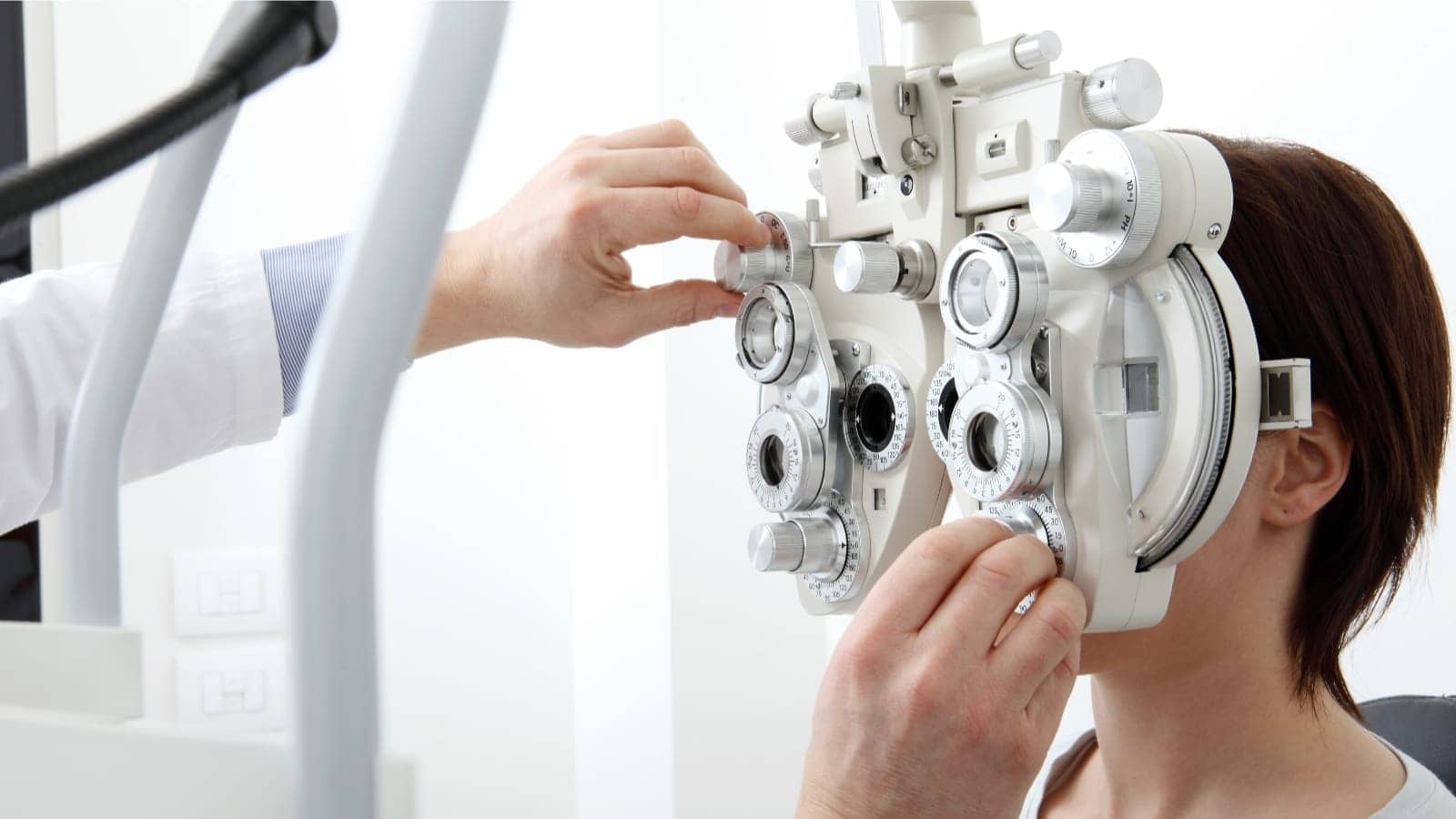 girl getting her vision tested by optometrist