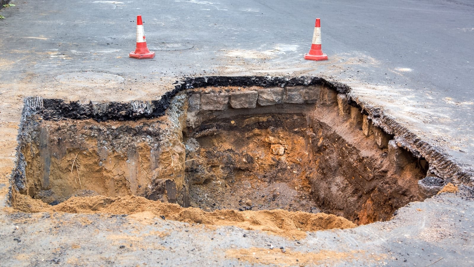 Sinkhole in the middle of a road