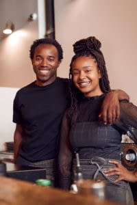 Two African American business owners smiling
