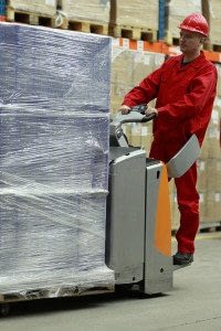 Man Working for a Wholesaler Operating Machinery