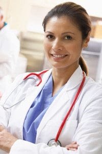 Female Physician Smiles at the Camera with her Arms Crossed