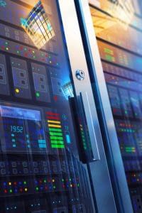 Several racks of computer servers and equipment in locked cabinets.