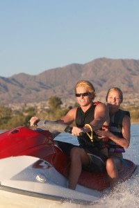 Two Individuals Riding on a Personal Watercraft