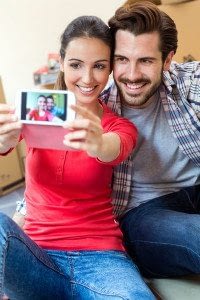 A Couple of Young Renters Taking a Photo of Themselves