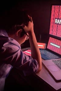 frustrated man looking at compromised computers