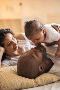 Parents spending time with their infant child.