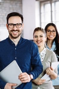 Portrait of successful business team posing in office