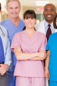 A Group of Health Professionals Stand and Smile at the Camera