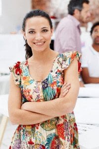 Professional Businesswoman Standing in Front of her Company with her Arms Crossed