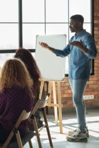 Group benefits professional presenting to a small team.