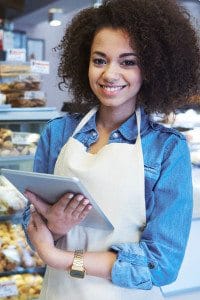 Female Restaurant Business Owner Holding an iPad