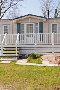 Exterior view of mobile home with front porch.