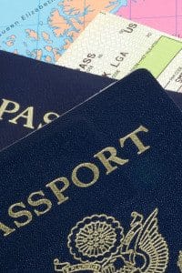 A Close Up of Two Passports on Top of a Map