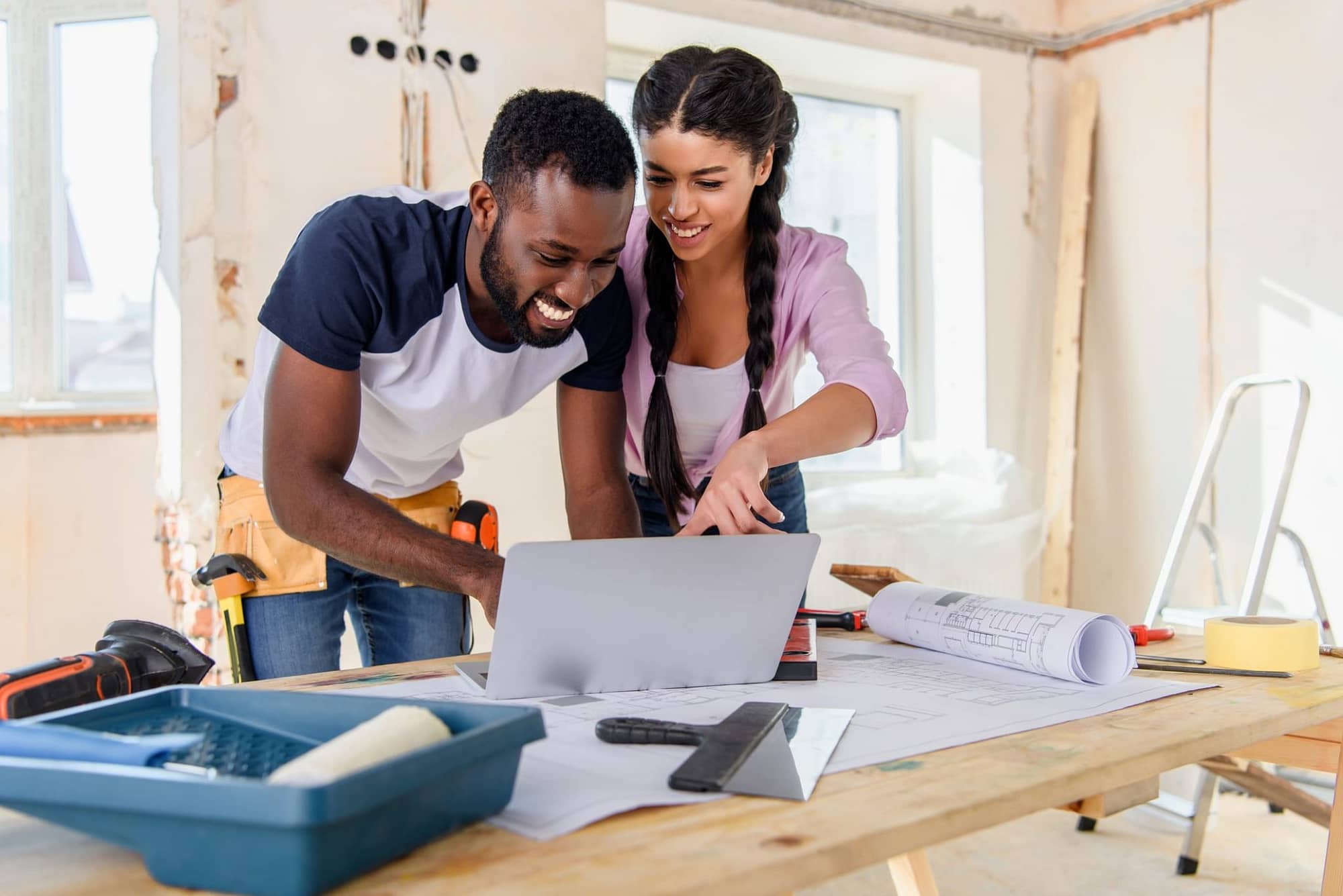 Happy African American Couple Renovating Home