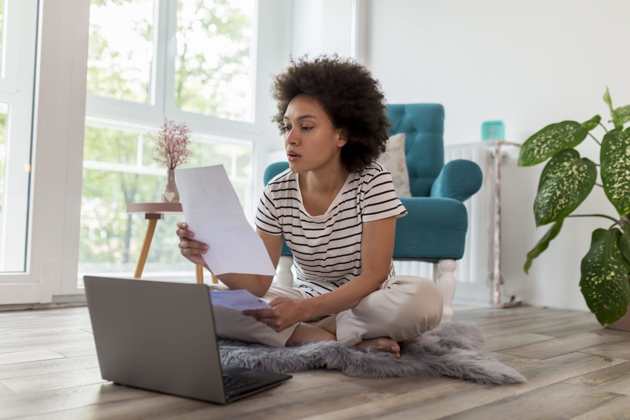 Young Woman Looking at Paperwork