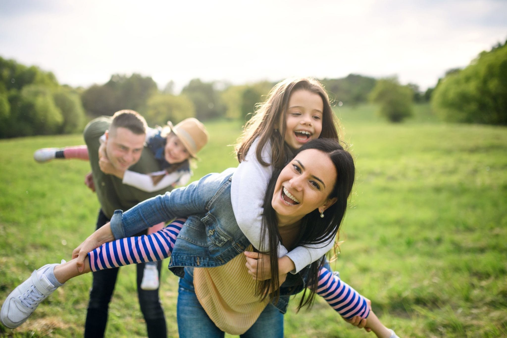 Happy Family Having Fun With Two Daughters