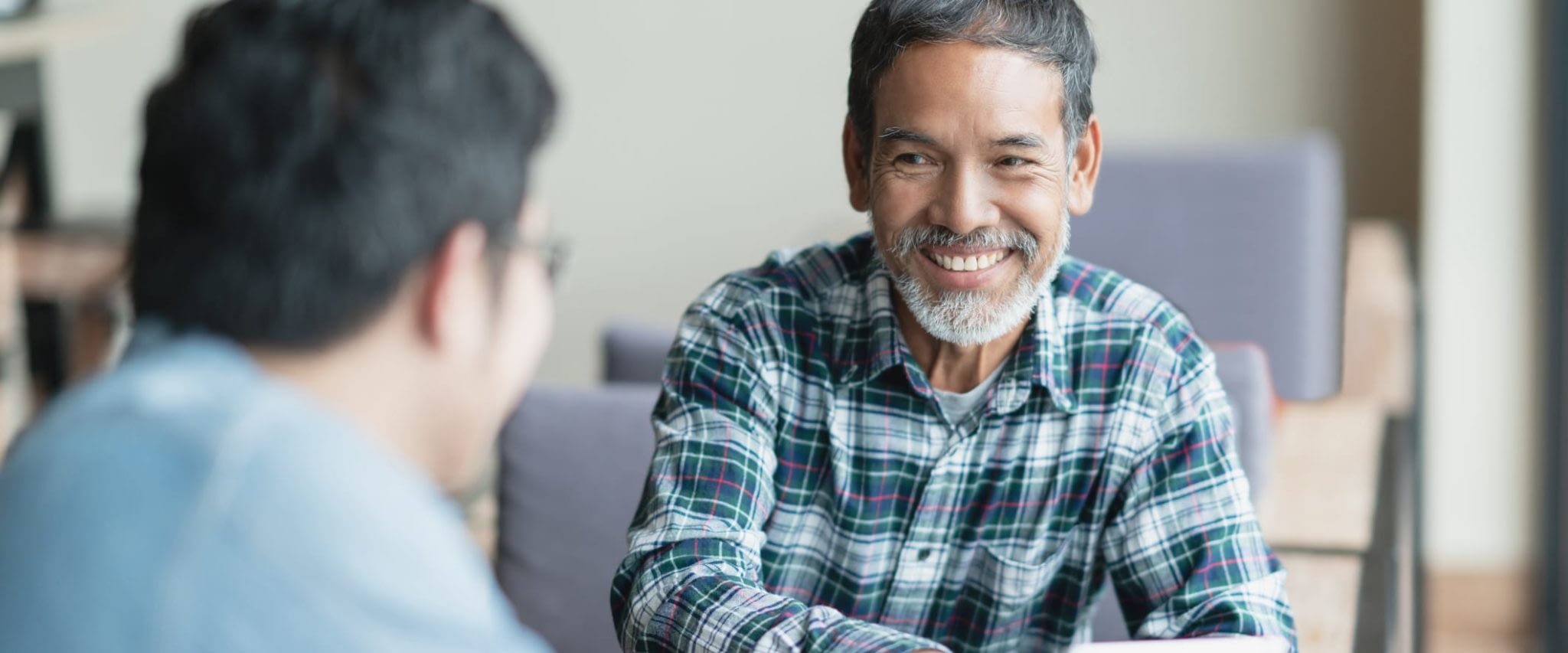 Happy Senior Asian Man With Advisor