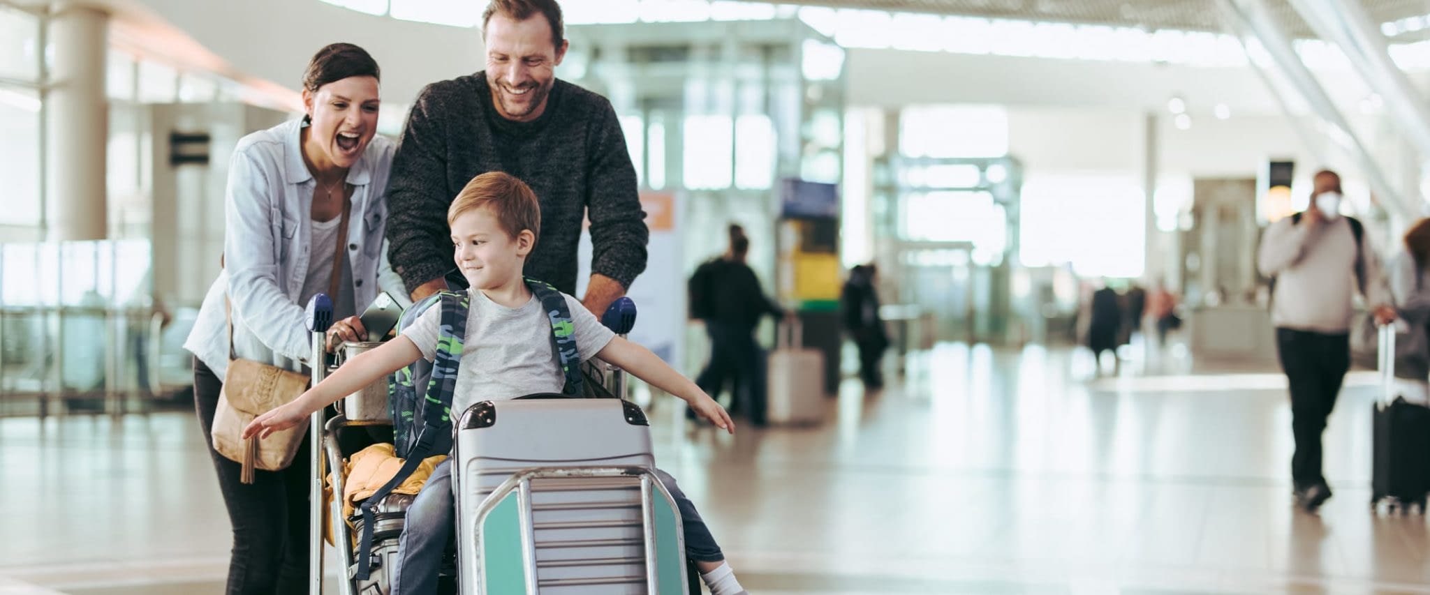 How to Travel Safely With Travel Insurance Family With Son at the Airport