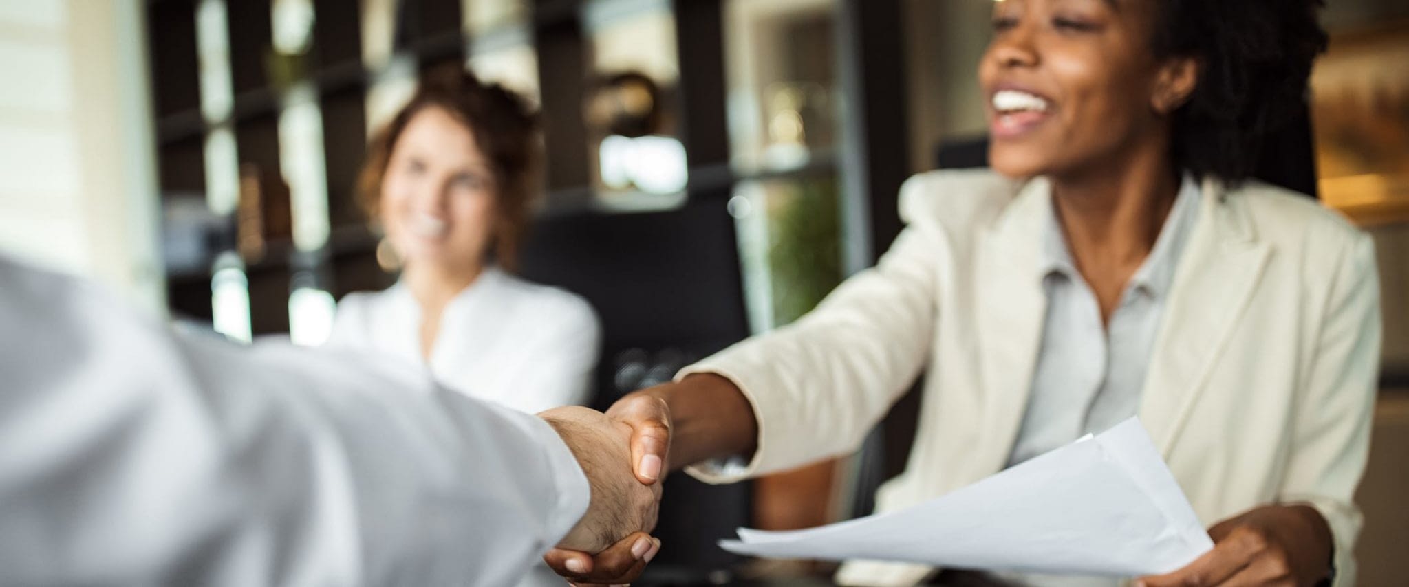 Happy Woman Shaking Hands With Man