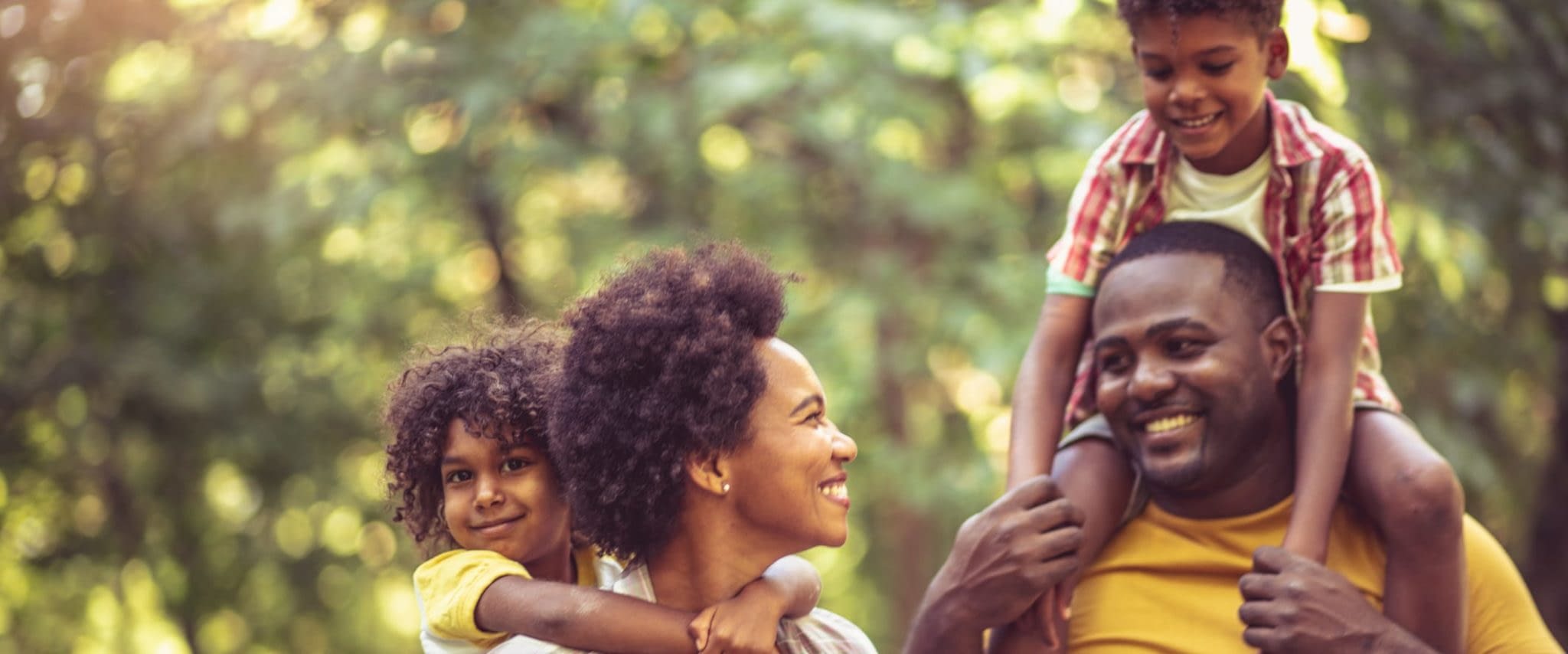 Family Floater Life Insurance Policy and How They Work Happy African American Family Taking a Walk